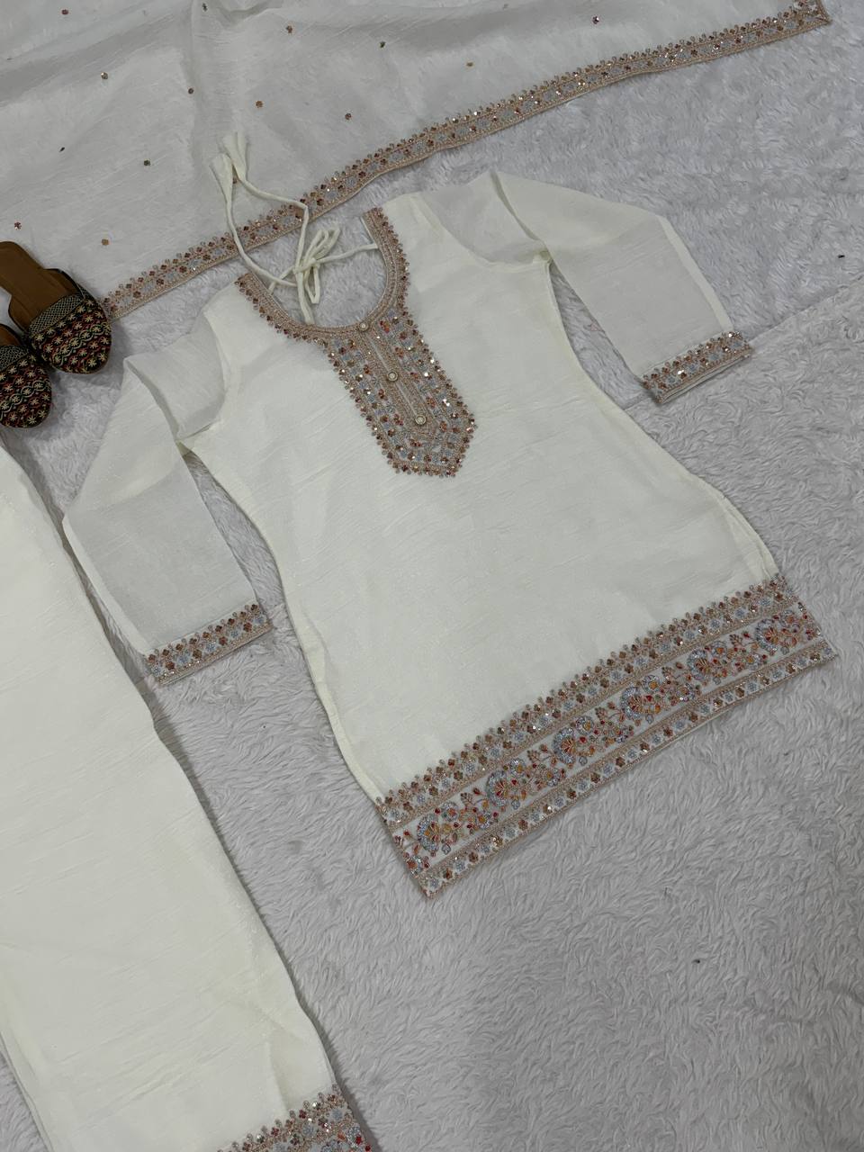 Pristine Ivory White Kurta and Palazzo Set Featuring Delicate Floral Embroidery, Sequined Borders, and a Matching Sheer Dupatta